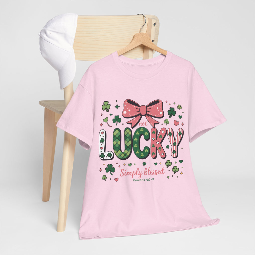 Simply Blessed Tee — “Not Lucky, Simply Blessed” with Pastel Bow, Clovers & Romans 4:7-8 Unisex Cotton Tee