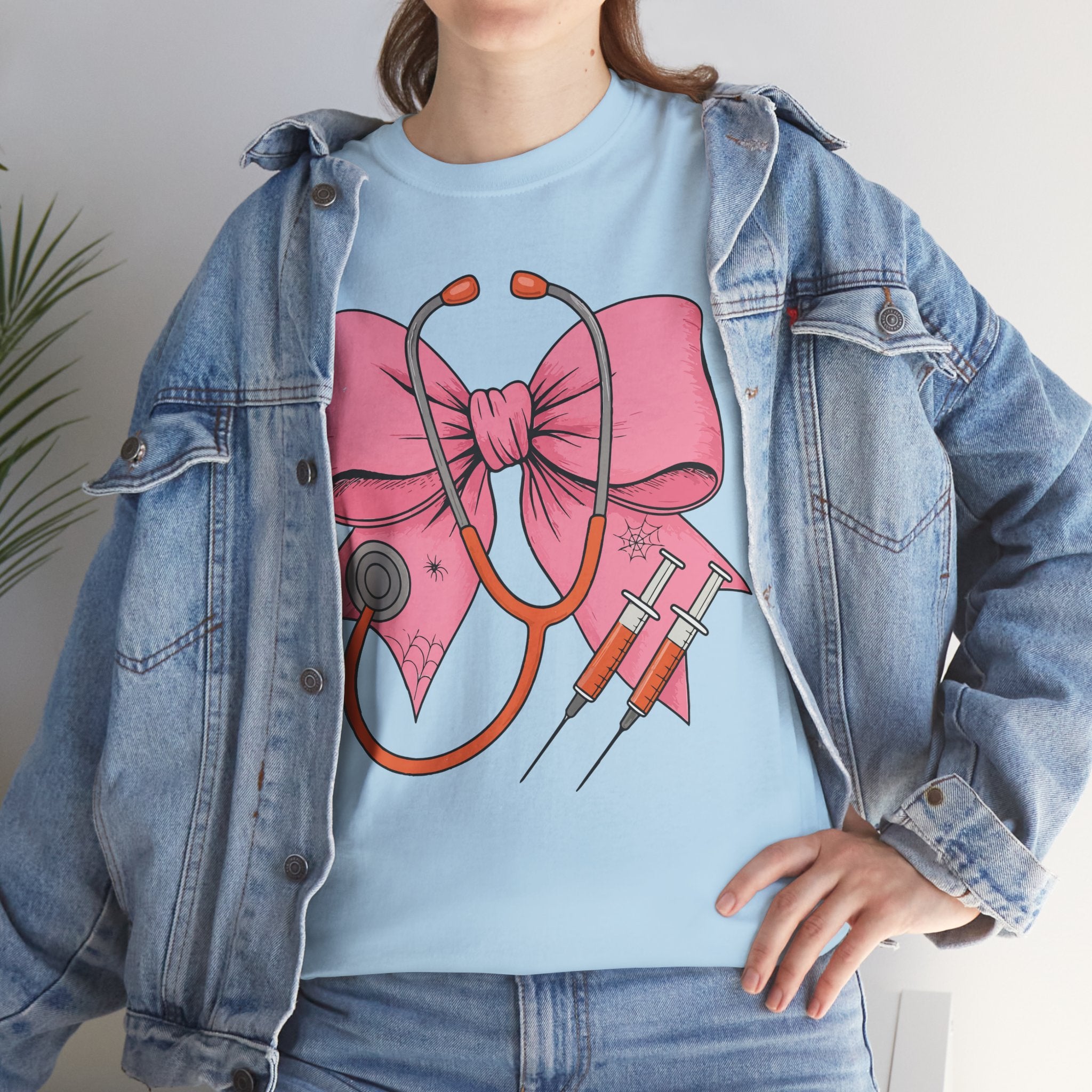 Halloween Nurse T‑Shirt — Pink Nurse Bow with Stethoscope, Syringes & Spider Webs..Unisex Cotton Tee
