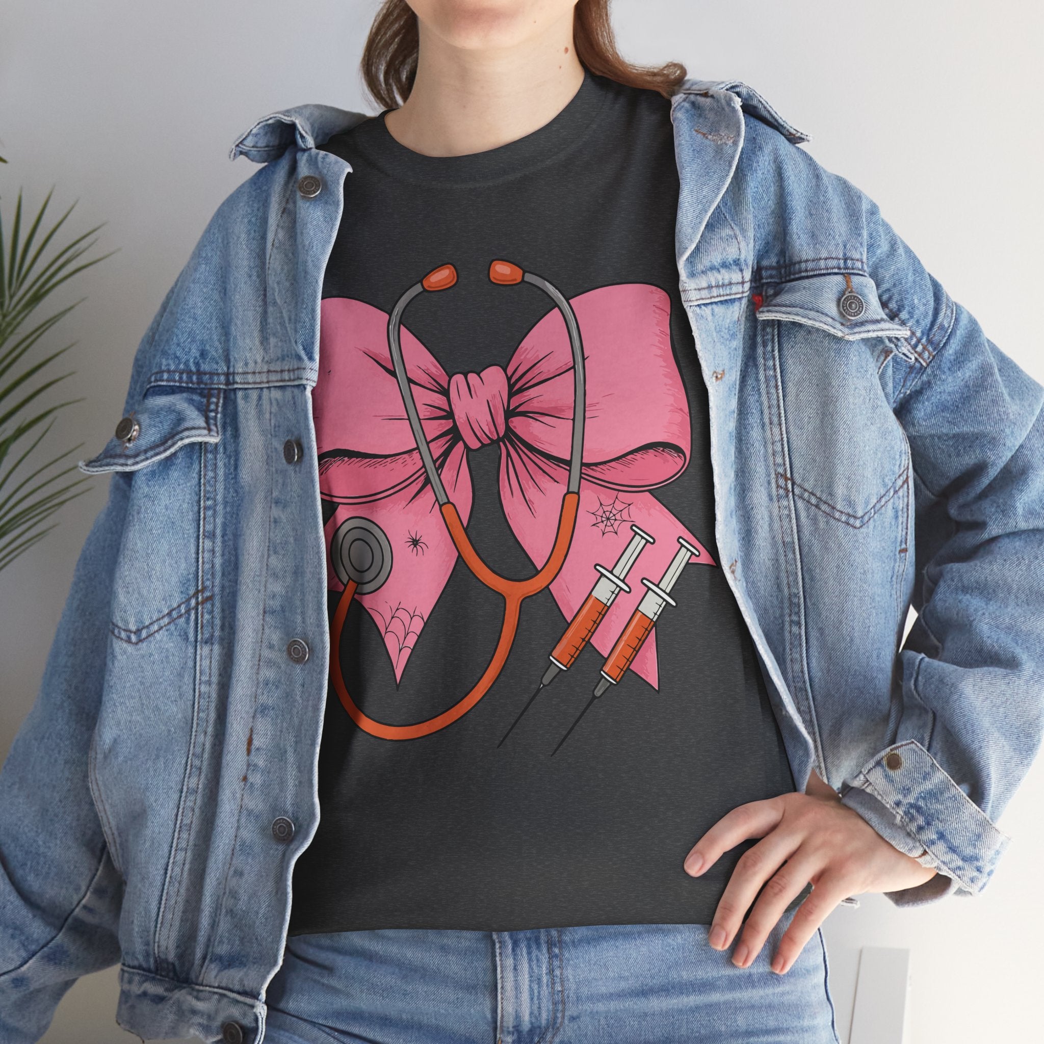 Halloween Nurse T‑Shirt — Pink Nurse Bow with Stethoscope, Syringes & Spider Webs..Unisex Cotton Tee
