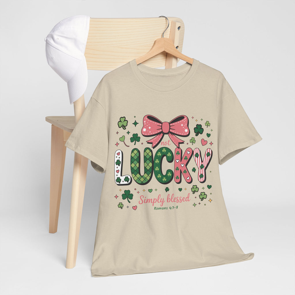 Simply Blessed Tee — “Not Lucky, Simply Blessed” with Pastel Bow, Clovers & Romans 4:7-8 Unisex Cotton Tee