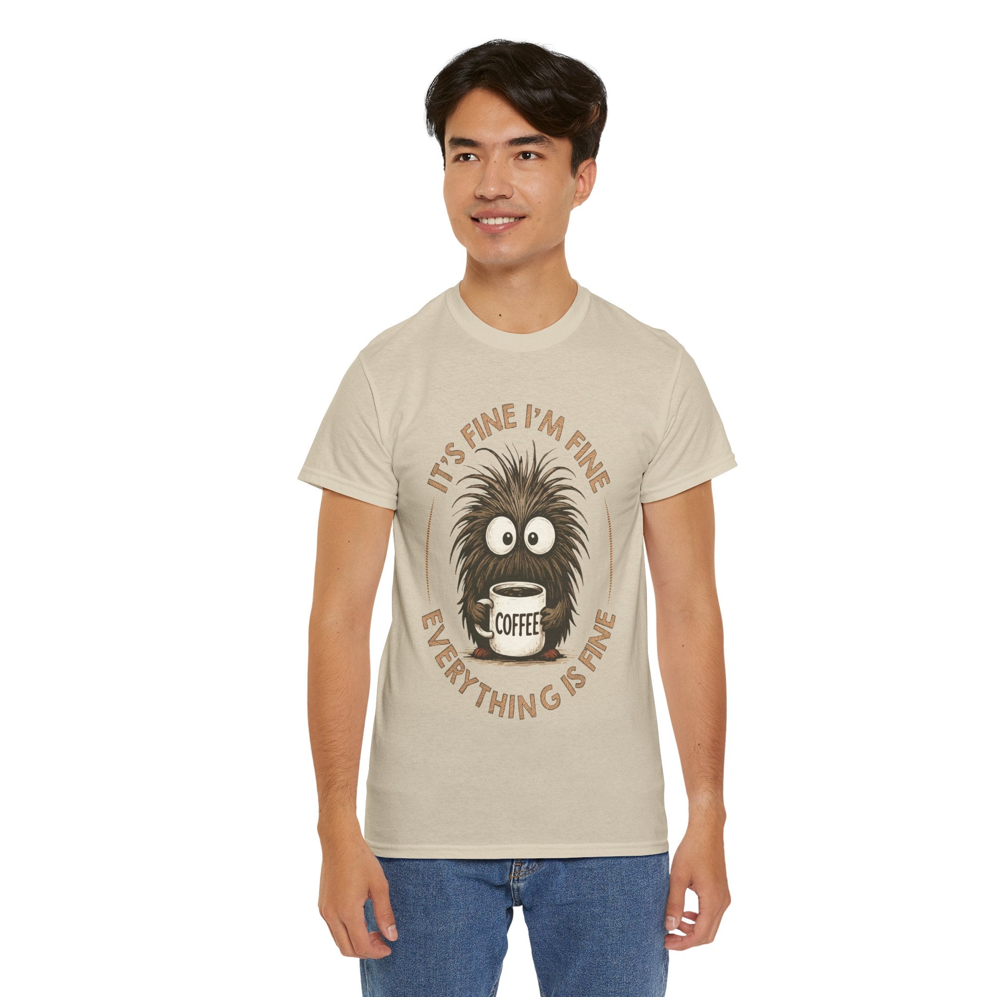 Funny Coffee Tee — “It’s fine I’m fine everything is fine” Fuzzy Creature Mug Unisex Cotton Tee
