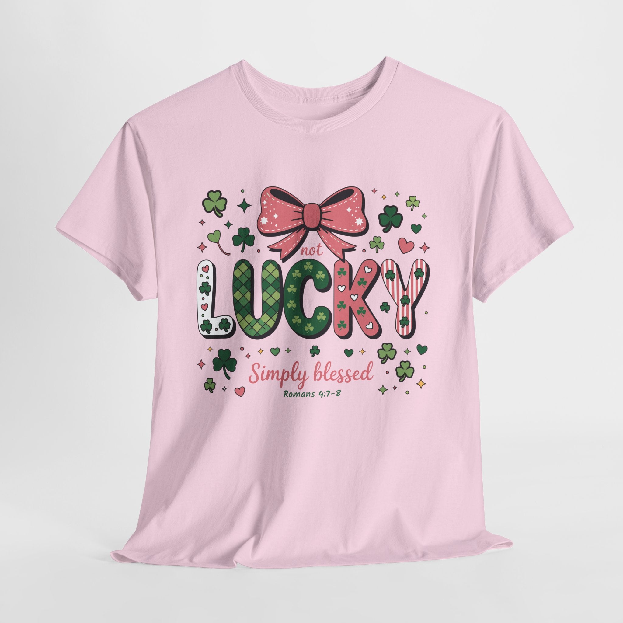 Simply Blessed Tee — “Not Lucky, Simply Blessed” with Pastel Bow, Clovers & Romans 4:7-8 Unisex Cotton Tee