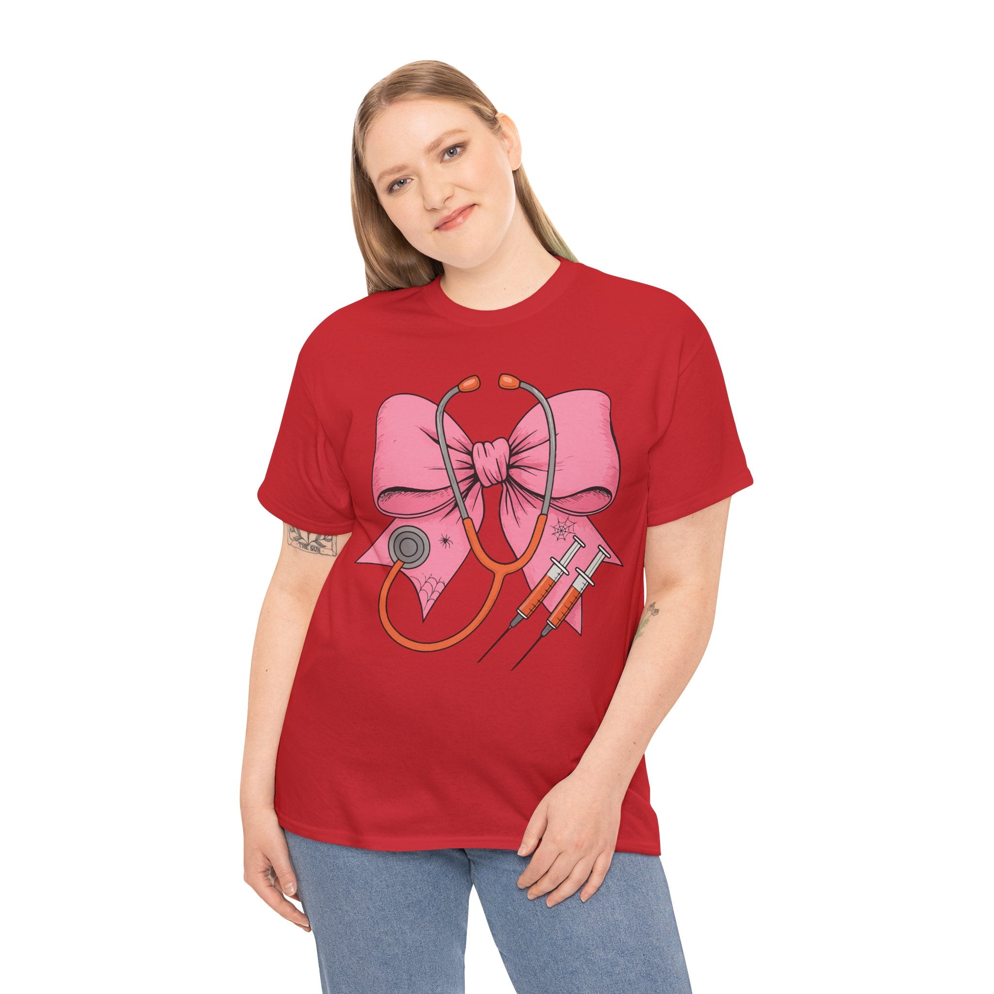 Halloween Nurse T‑Shirt — Pink Nurse Bow with Stethoscope, Syringes & Spider Webs..Unisex Cotton Tee