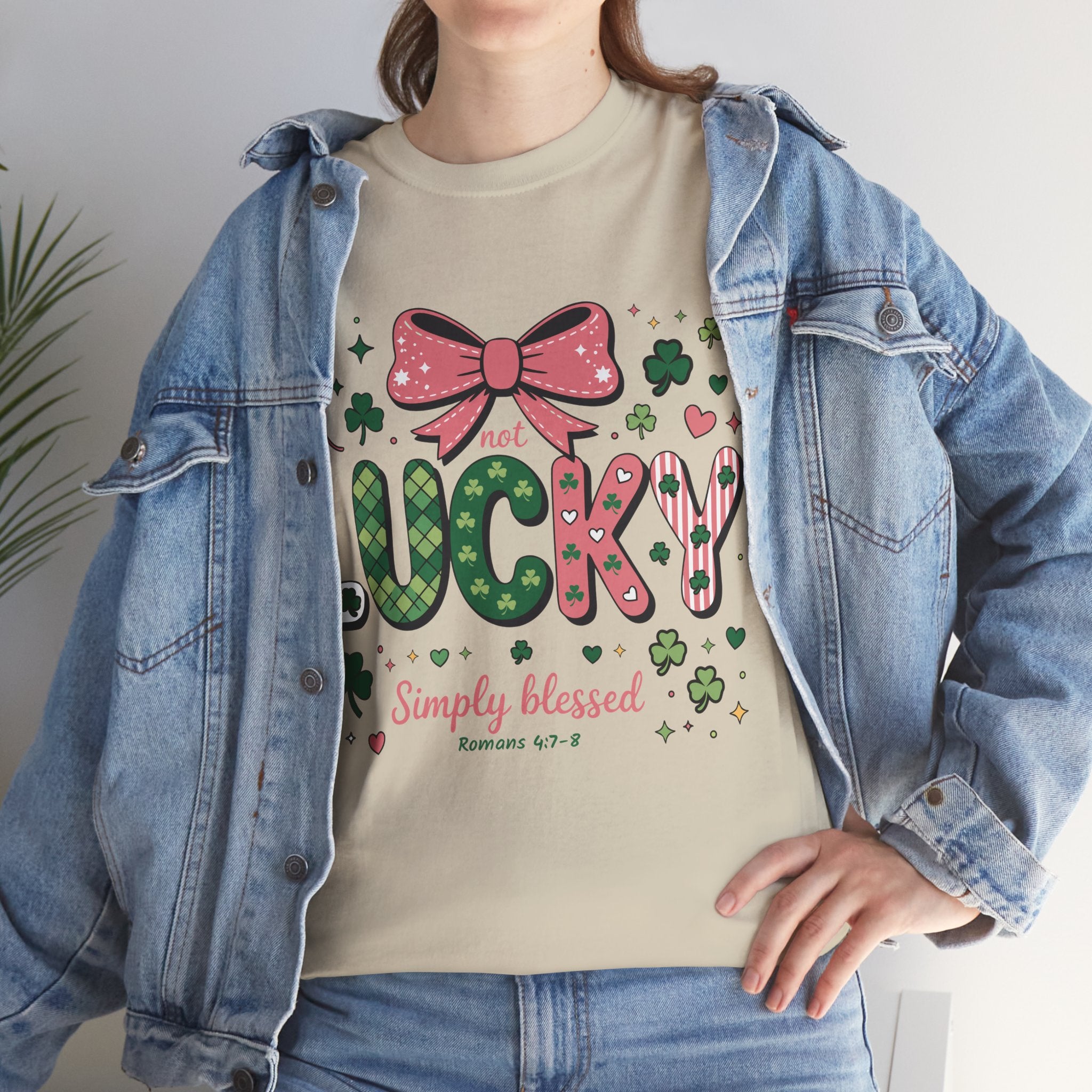 Simply Blessed Tee — “Not Lucky, Simply Blessed” with Pastel Bow, Clovers & Romans 4:7-8 Unisex Cotton Tee