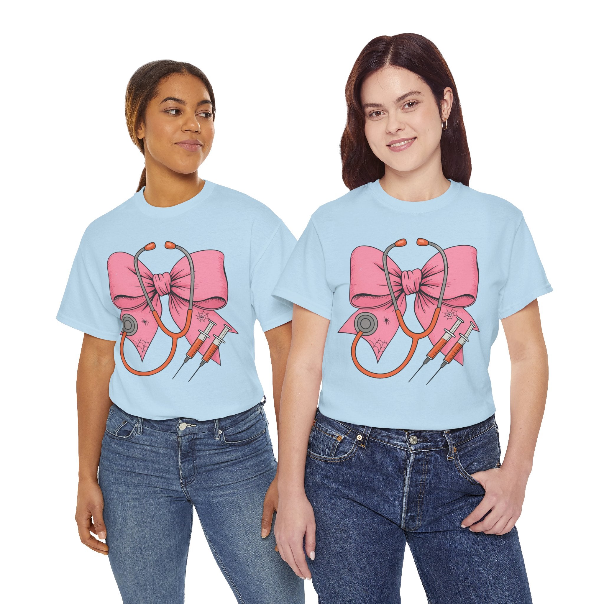 Halloween Nurse T‑Shirt — Pink Nurse Bow with Stethoscope, Syringes & Spider Webs..Unisex Cotton Tee