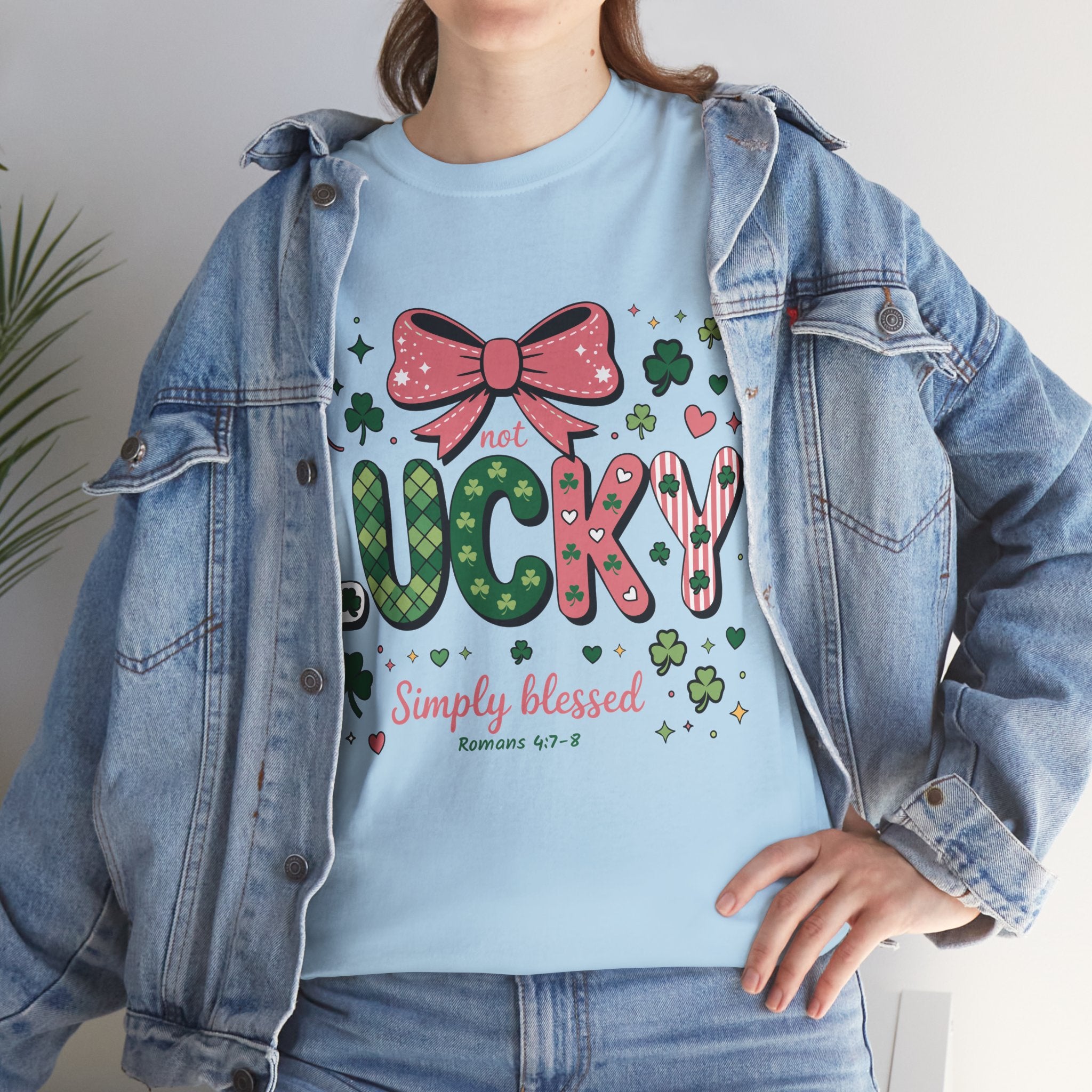 Simply Blessed Tee — “Not Lucky, Simply Blessed” with Pastel Bow, Clovers & Romans 4:7-8 Unisex Cotton Tee