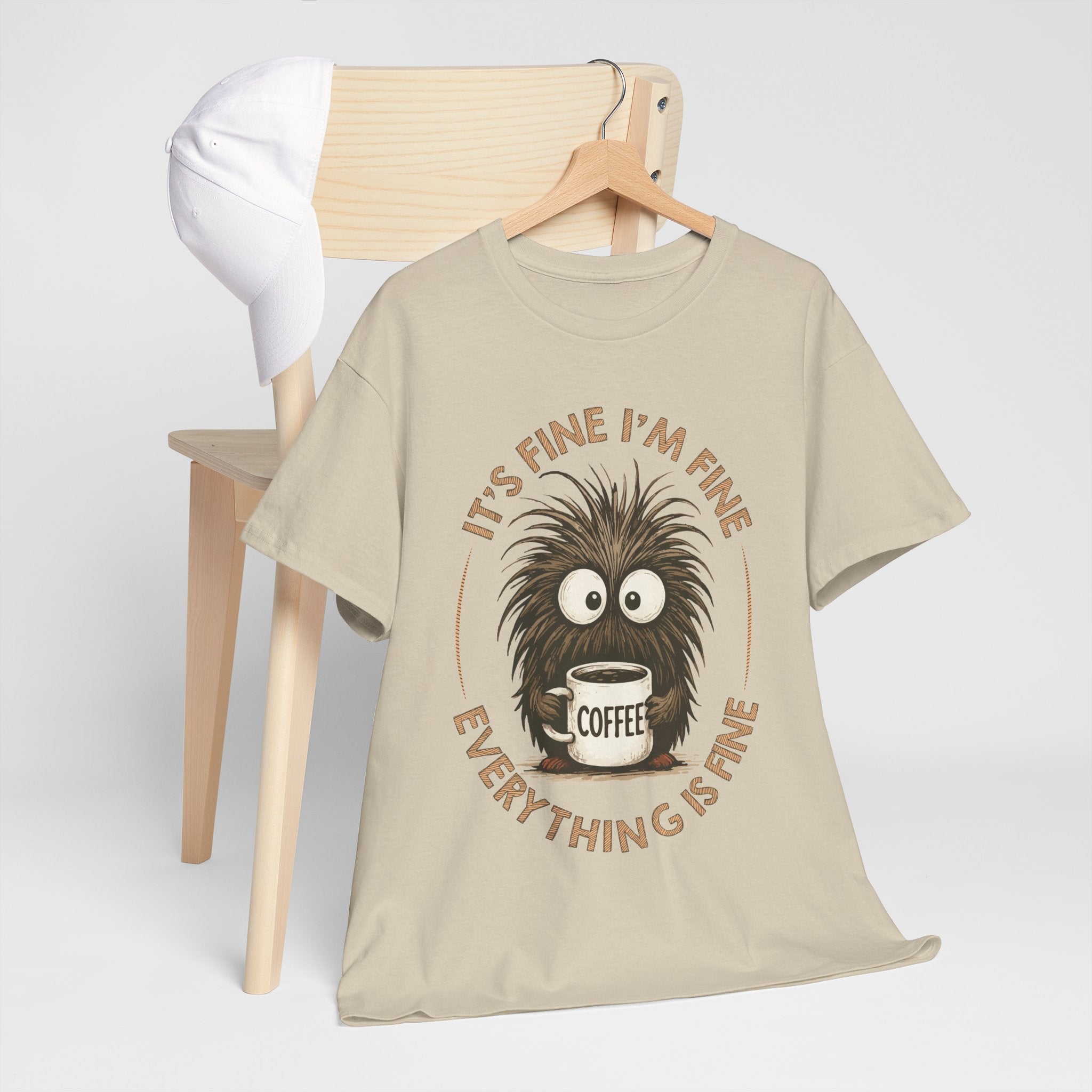 Funny Coffee Tee — “It’s fine I’m fine everything is fine” Fuzzy Creature Mug Unisex Cotton Tee