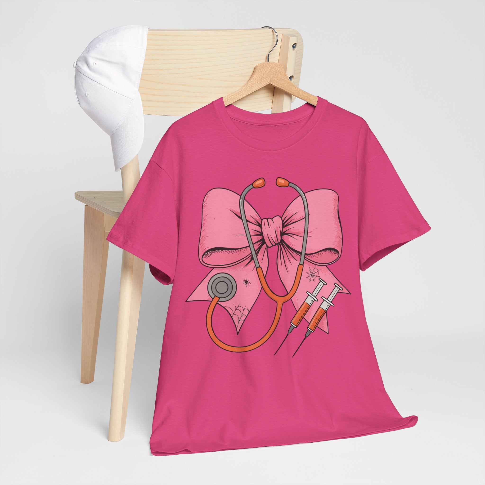 Halloween Nurse T‑Shirt — Pink Nurse Bow with Stethoscope, Syringes & Spider Webs..Unisex Cotton Tee