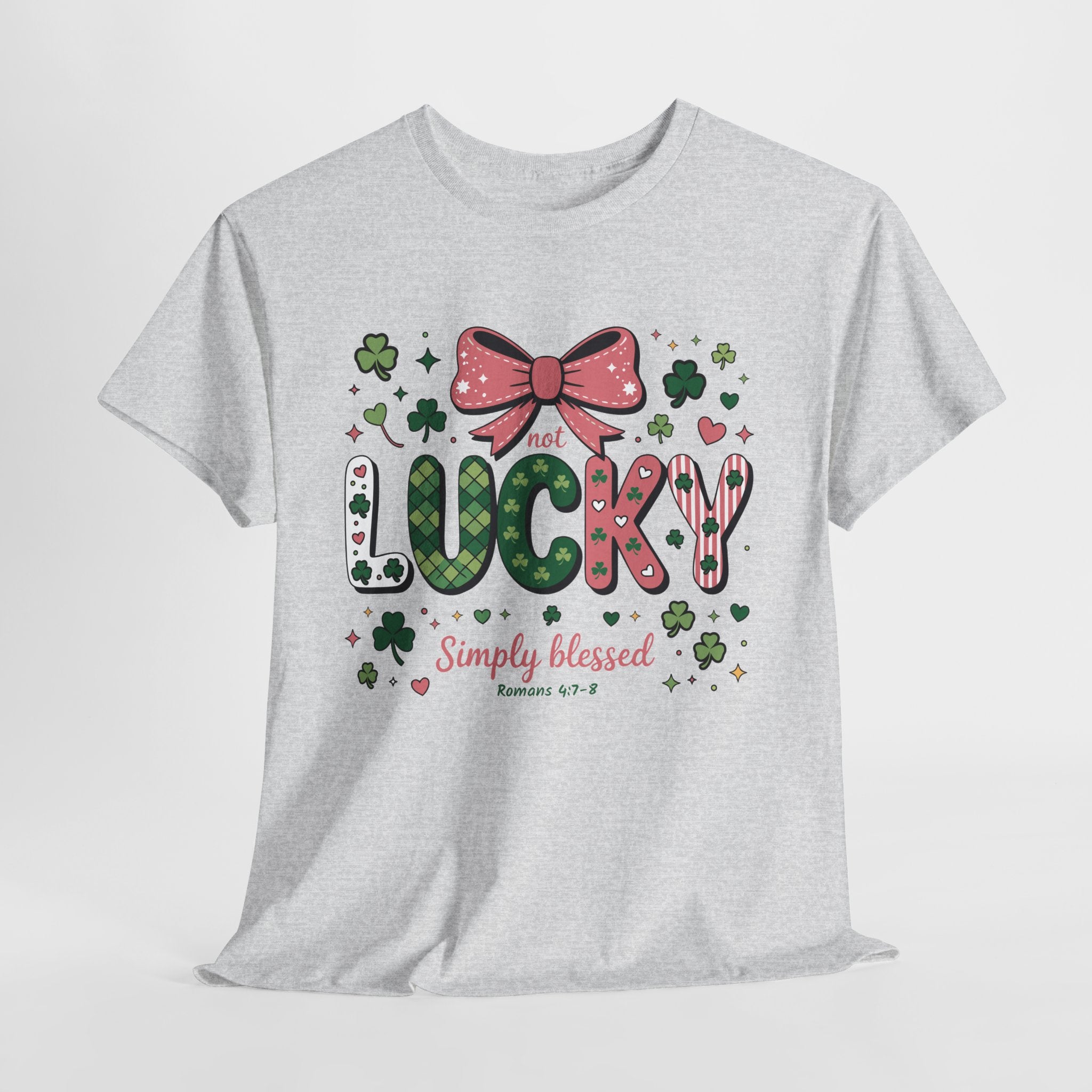 Simply Blessed Tee — “Not Lucky, Simply Blessed” with Pastel Bow, Clovers & Romans 4:7-8 Unisex Cotton Tee