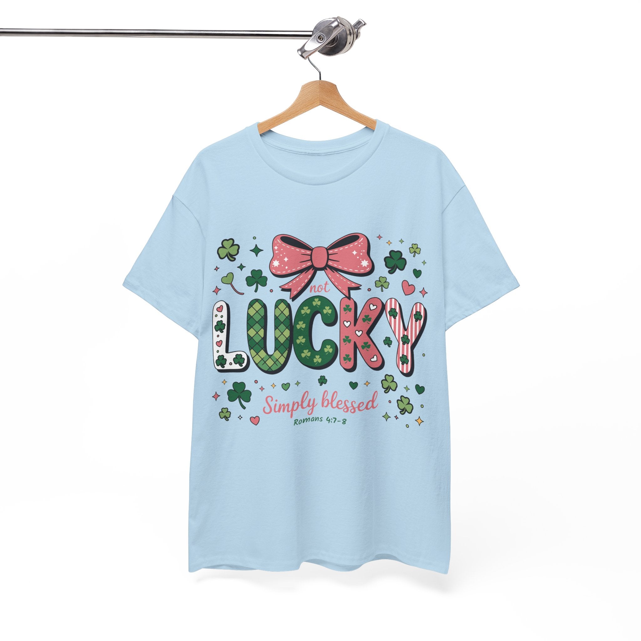 Simply Blessed Tee — “Not Lucky, Simply Blessed” with Pastel Bow, Clovers & Romans 4:7-8 Unisex Cotton Tee