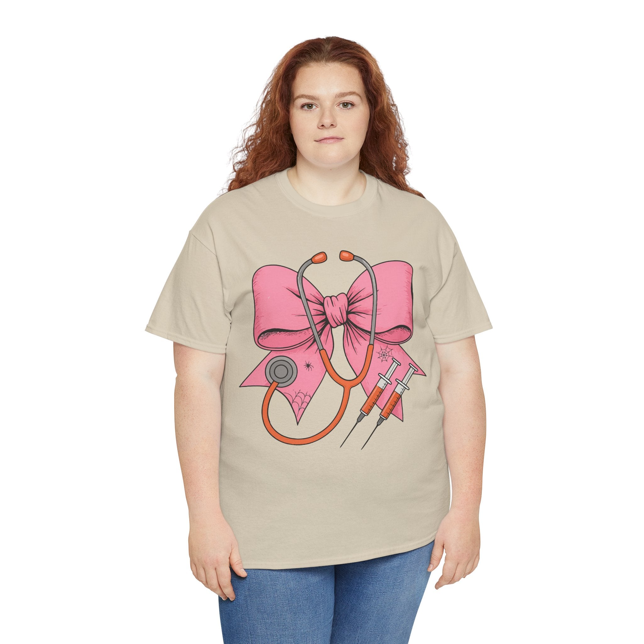 Halloween Nurse T‑Shirt — Pink Nurse Bow with Stethoscope, Syringes & Spider Webs..Unisex Cotton Tee