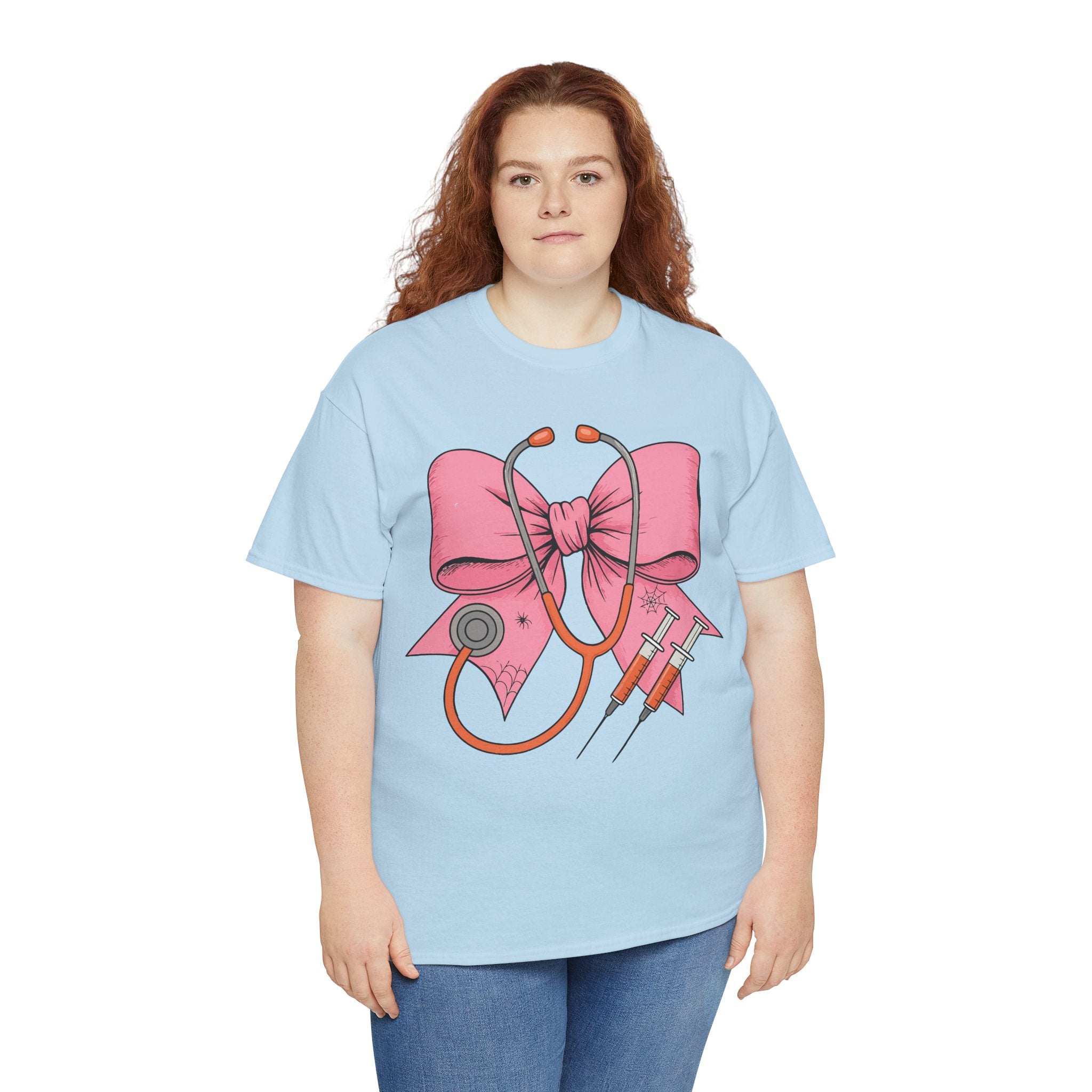 Halloween Nurse T‑Shirt — Pink Nurse Bow with Stethoscope, Syringes & Spider Webs..Unisex Cotton Tee