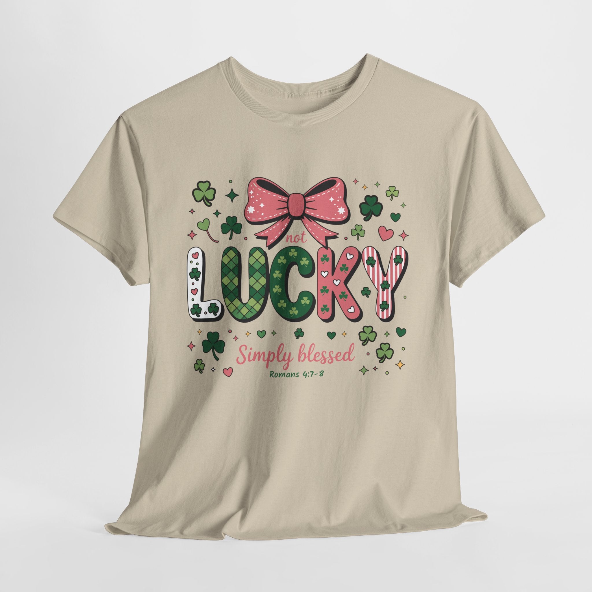 Simply Blessed Tee — “Not Lucky, Simply Blessed” with Pastel Bow, Clovers & Romans 4:7-8 Unisex Cotton Tee