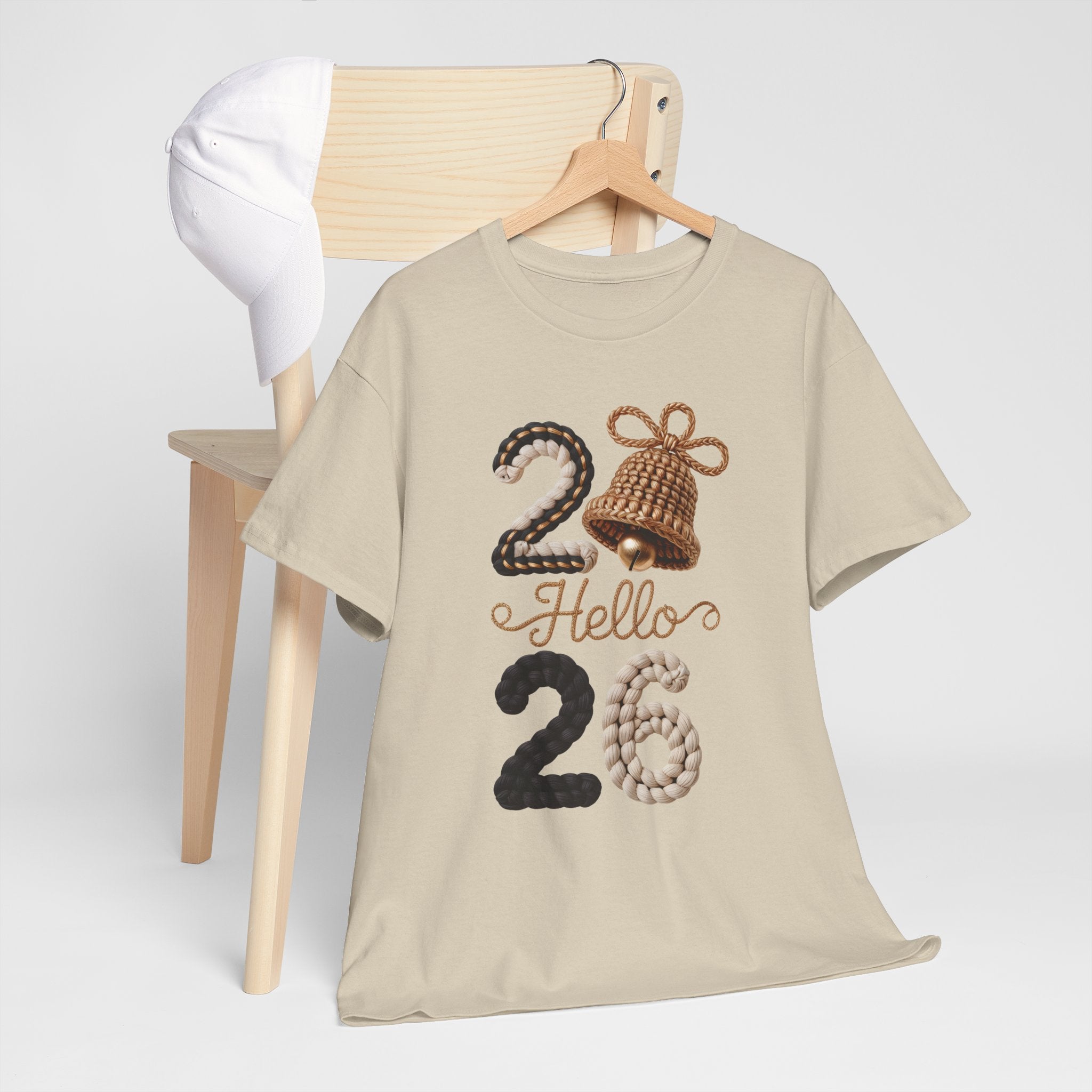 Hello 2026 Tee — Cozy Faux Yarn Braided Numbers with Woven Golden Bell..Unisex Cotton Tee