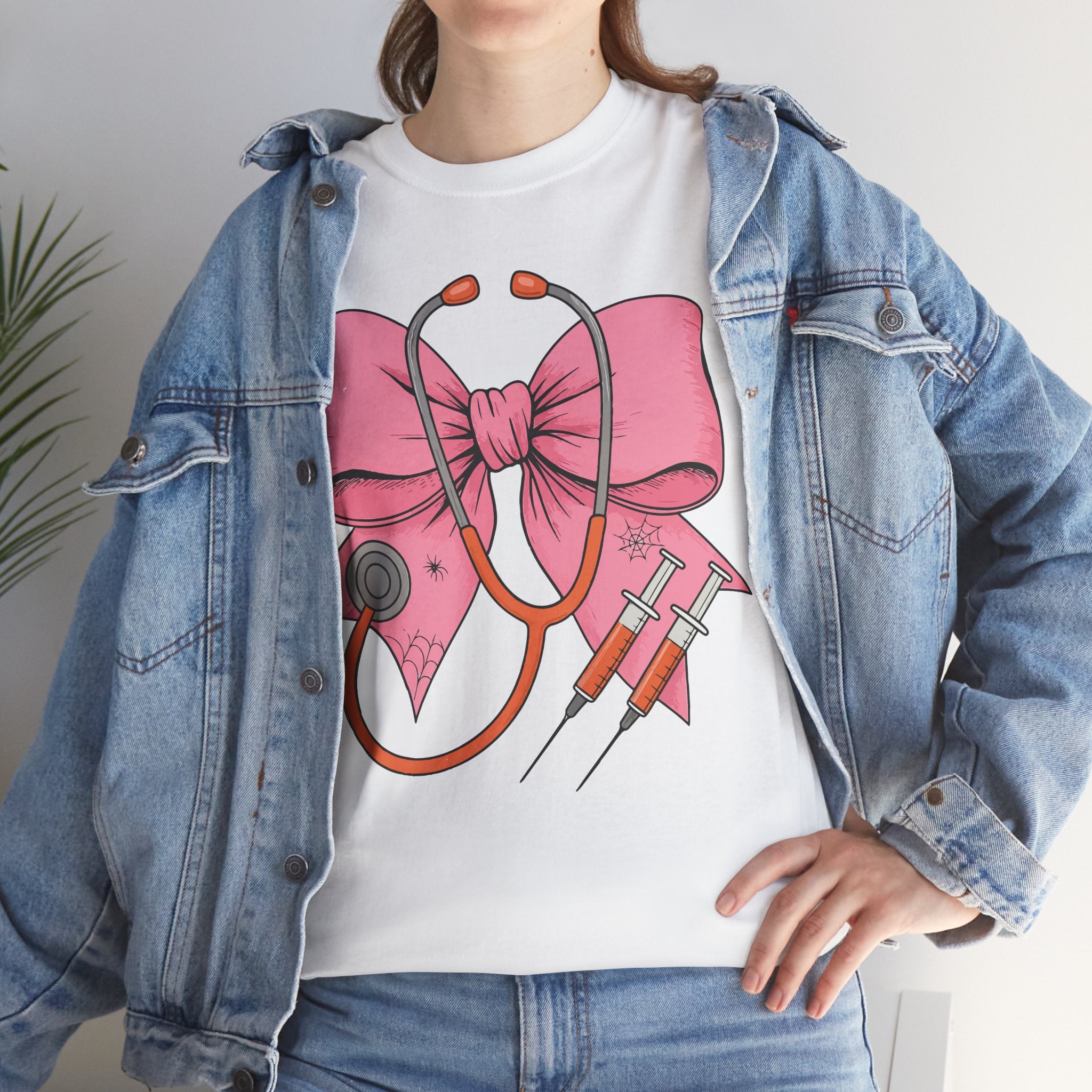 Halloween Nurse T‑Shirt — Pink Nurse Bow with Stethoscope, Syringes & Spider Webs..Unisex Cotton Tee